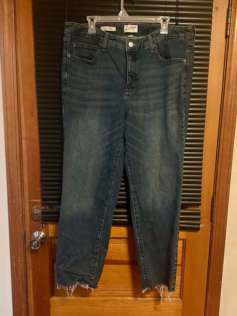 Universal thread mid rise 80s slim distressed bottom.